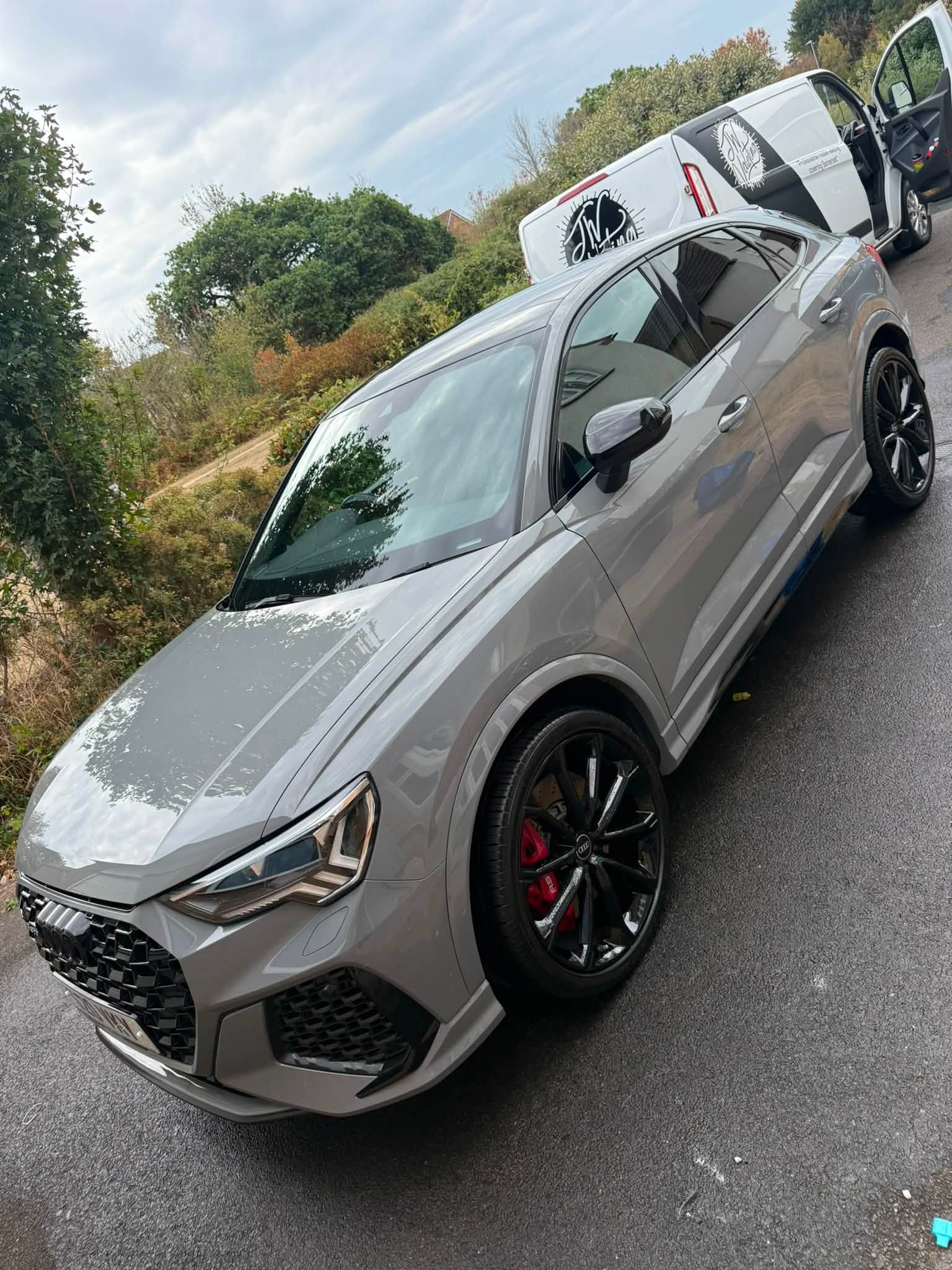 Freshly detailed Audi with JW Valeting van